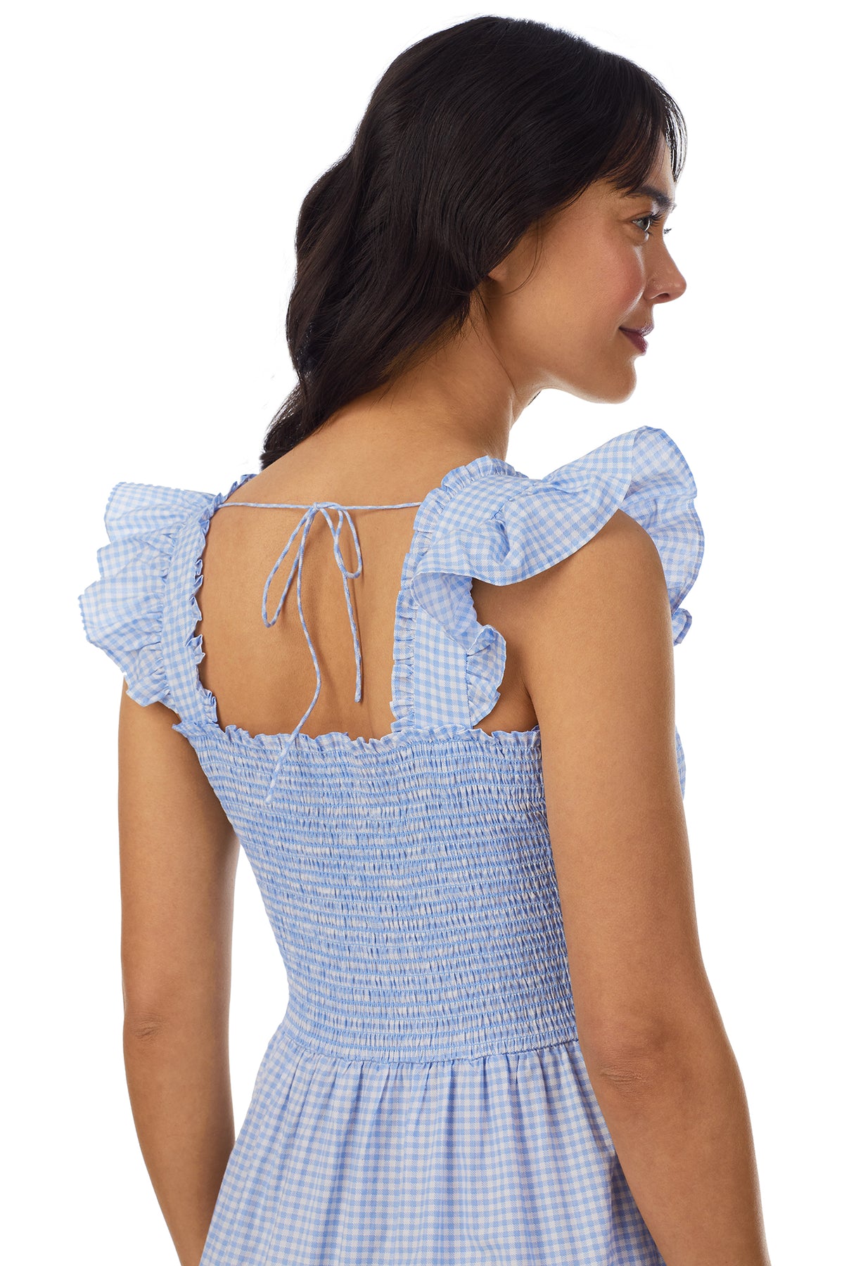 A lady wearing a blue butterfly sleeve Dress with white check pattern