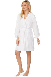 A lady wearing white short wrap robe with long sleeves and stripe texture.