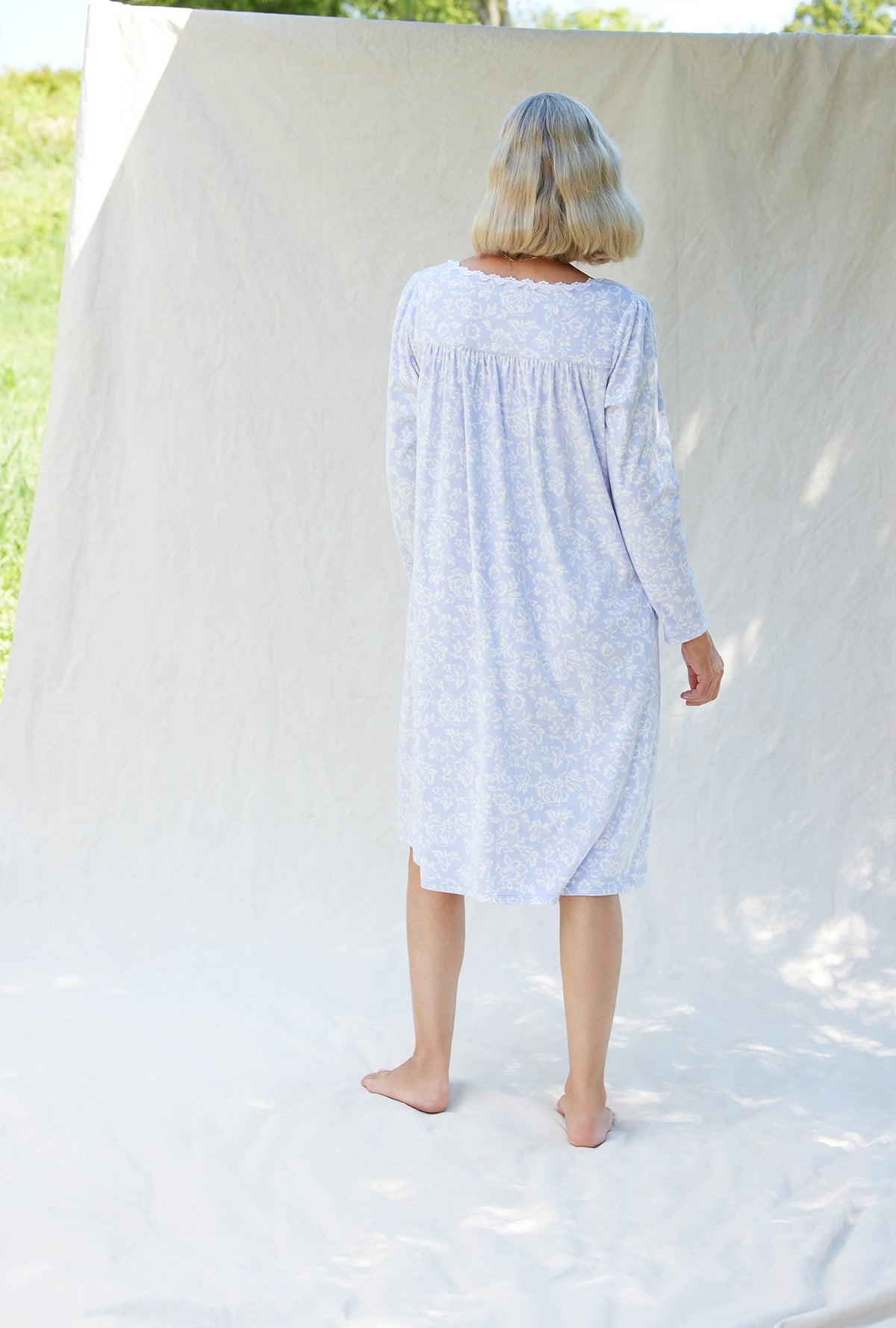 A lady wearing a dream fleece long sleeve waltz nightgown.