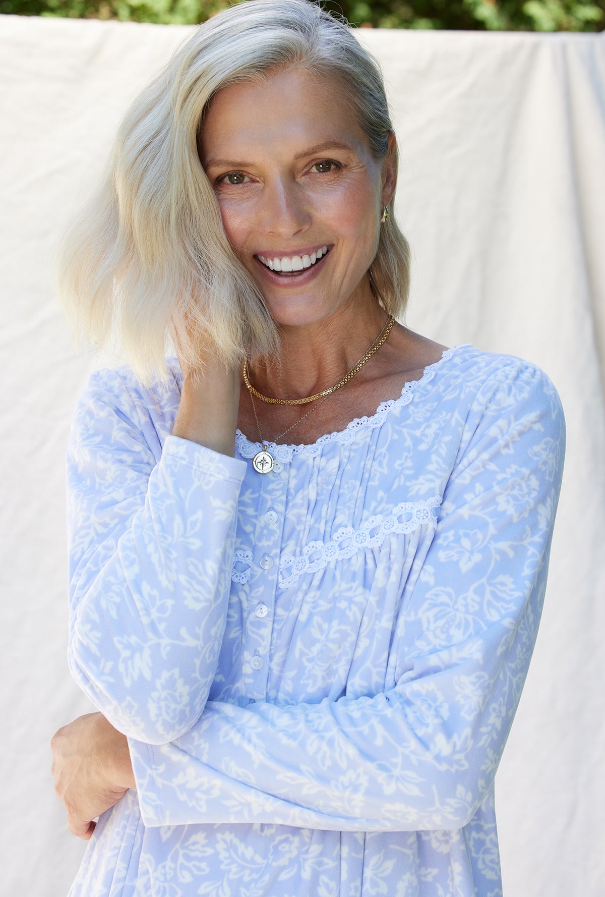 A lady wearing a dream fleece long sleeve waltz nightgown.