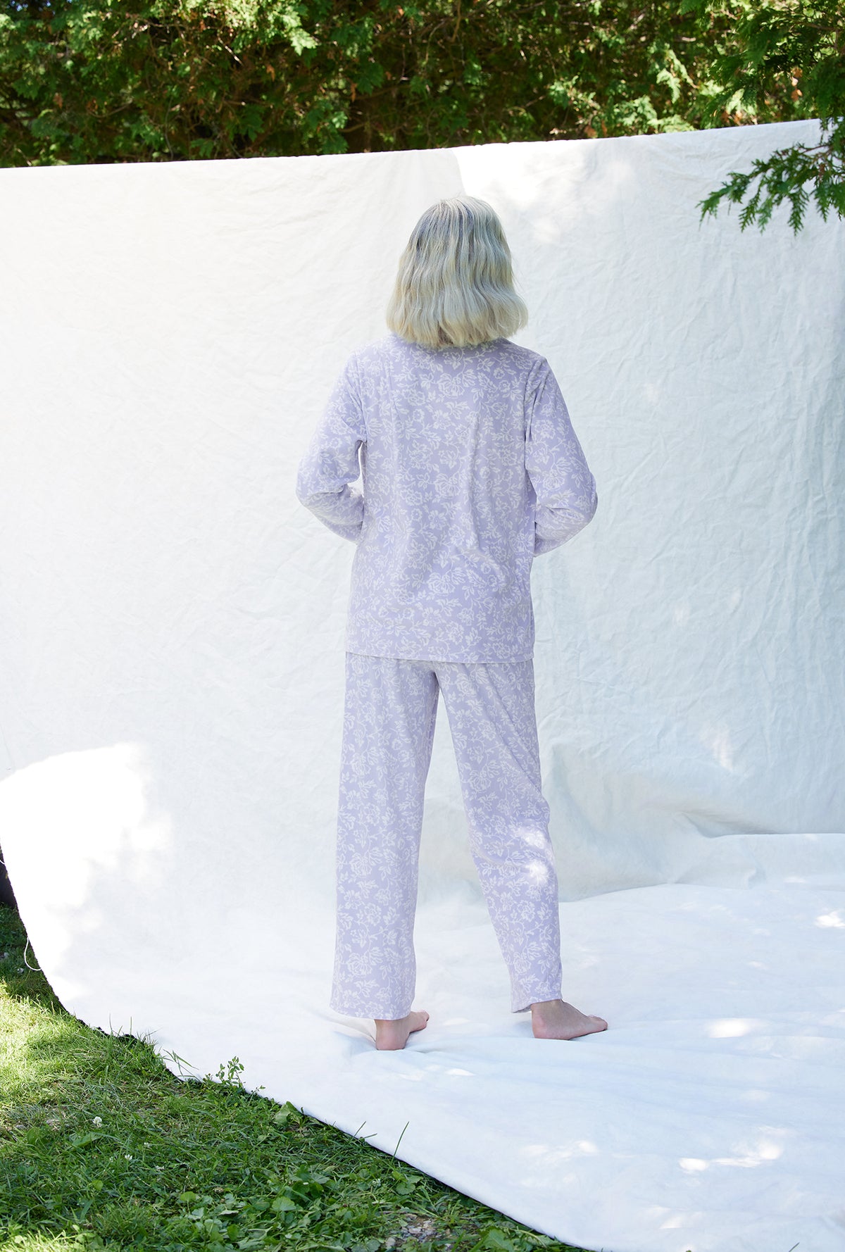 A lady wearing a dream fleece long sleeve long pajama.