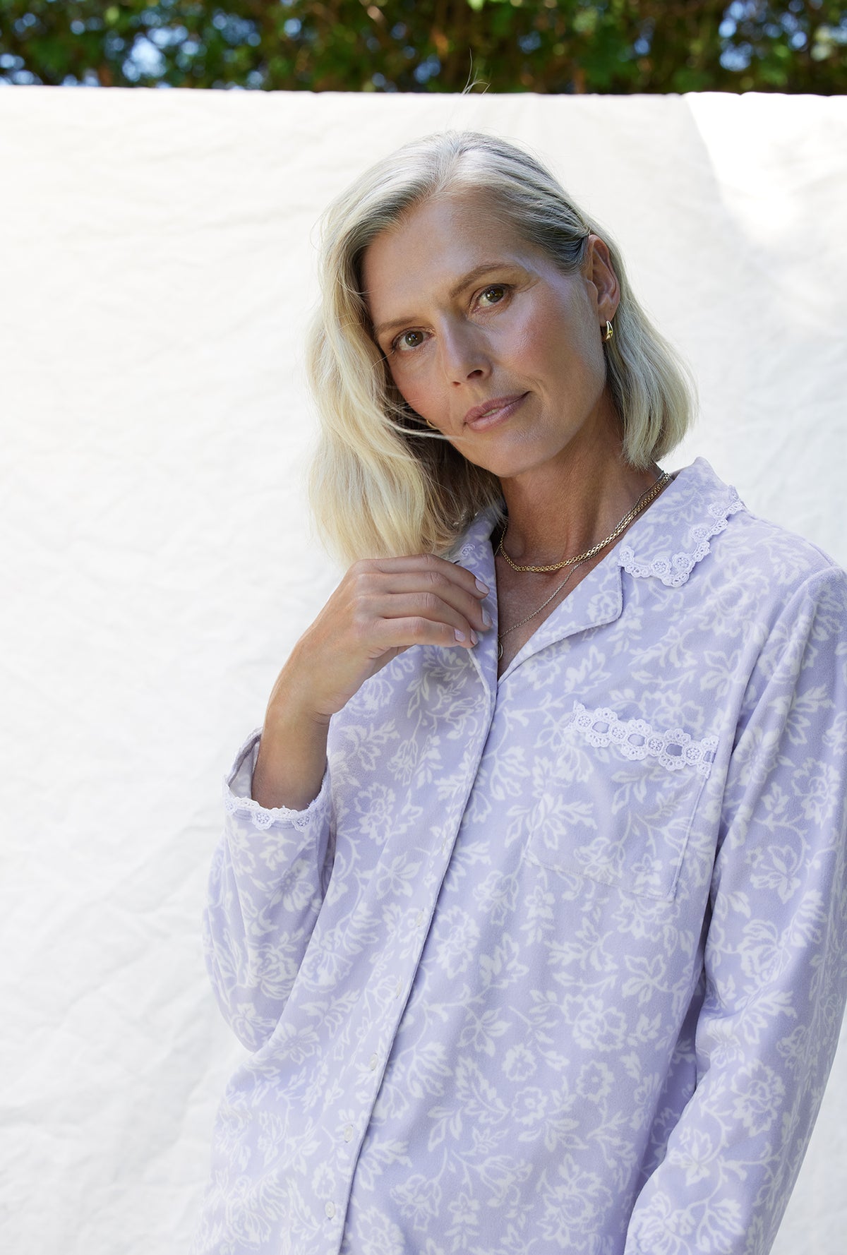A lady wearing a dream fleece long sleeve long pajama.