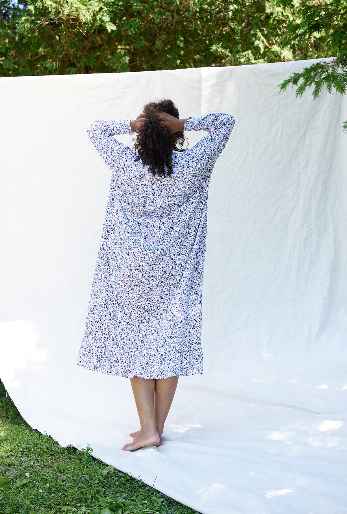 A lady wearing a berry dream long sleeve cotton knit long nightgown plus.
