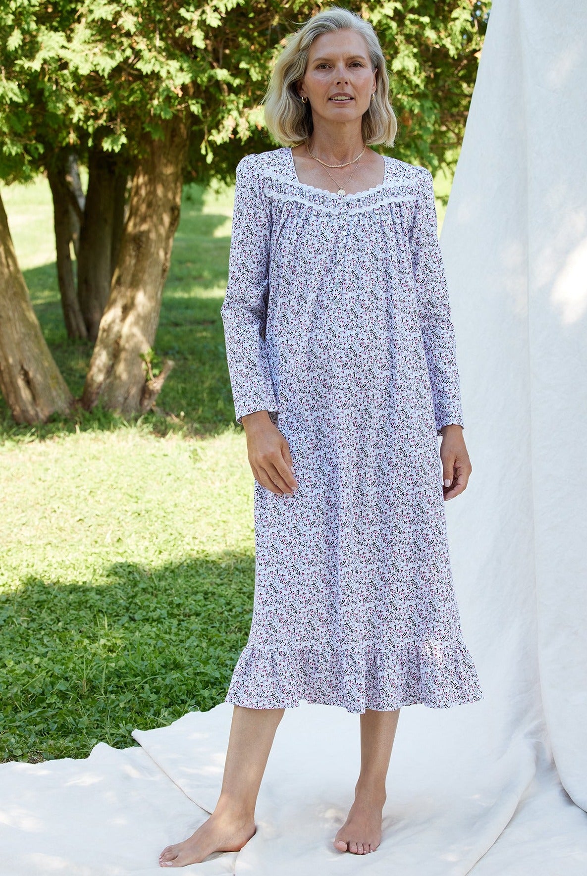 A lady wearing a berry dream long sleeve cotton knit long nightgown.