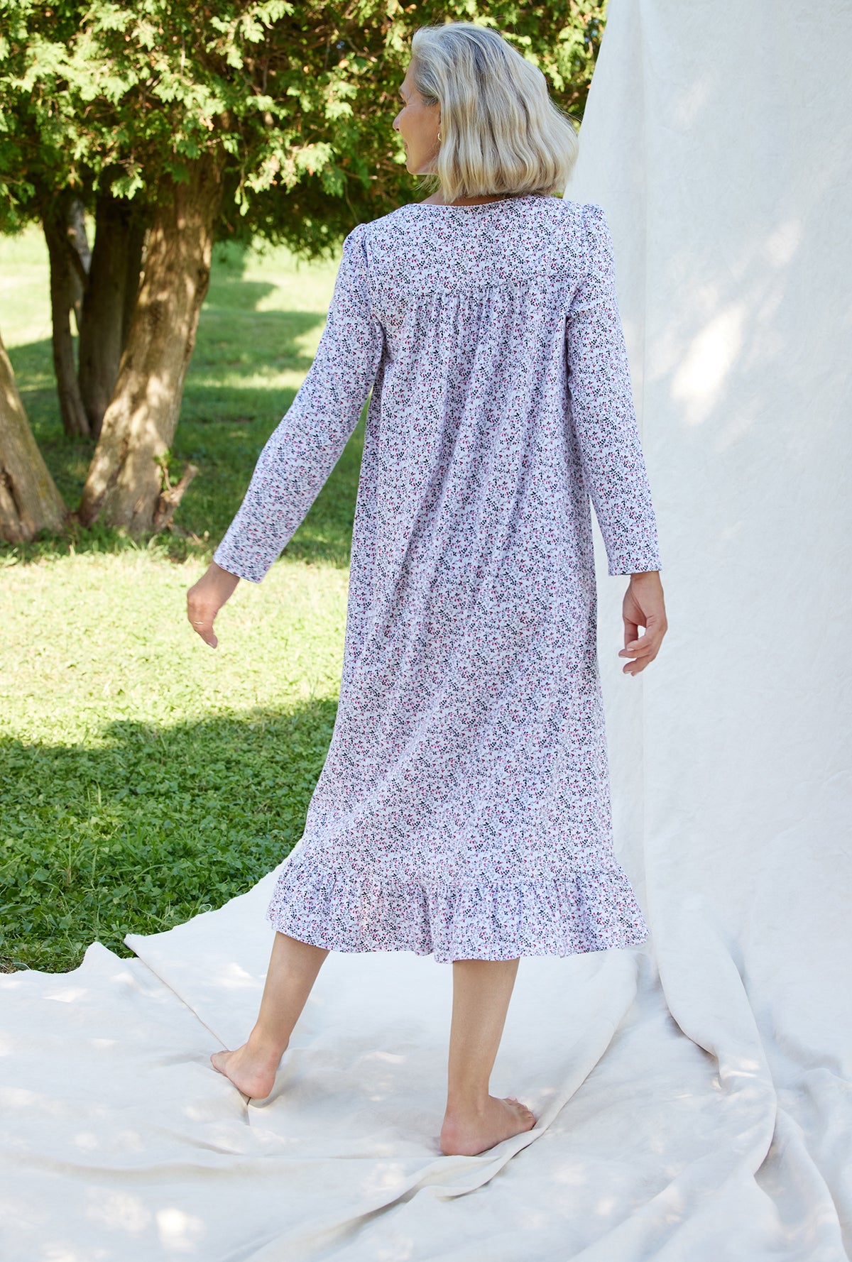 A lady wearing a berry dream long sleeve cotton knit long nightgown.