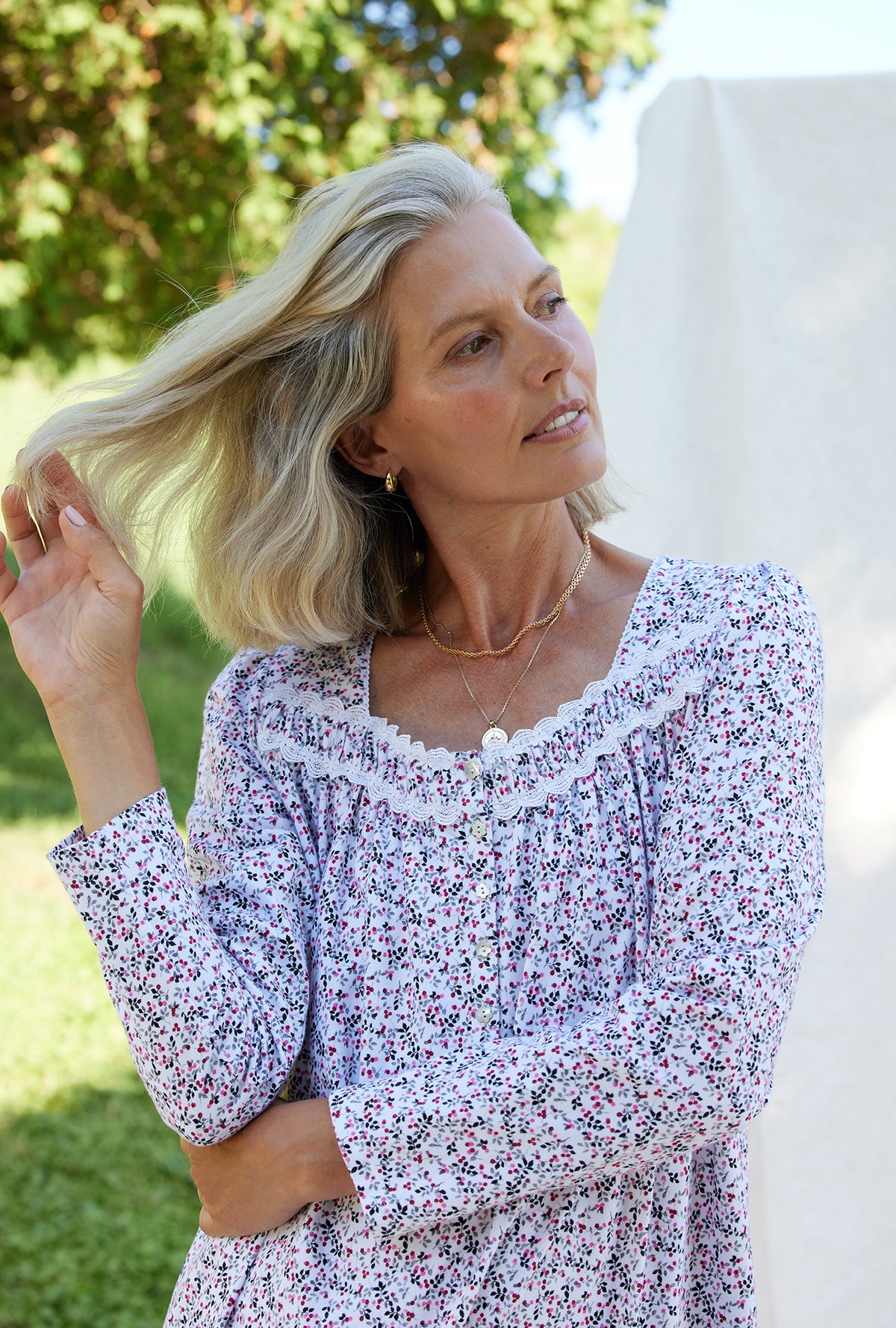 A lady wearing a berry dream long sleeve cotton knit long nightgown.
