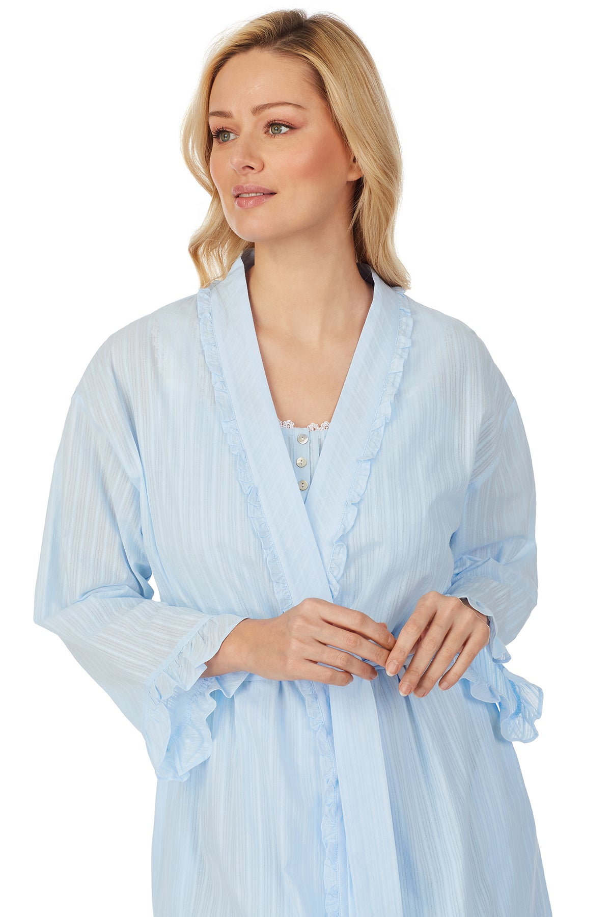 Upper body of A lady wearing blue short wrap robe with long sleeves and stripe texture.