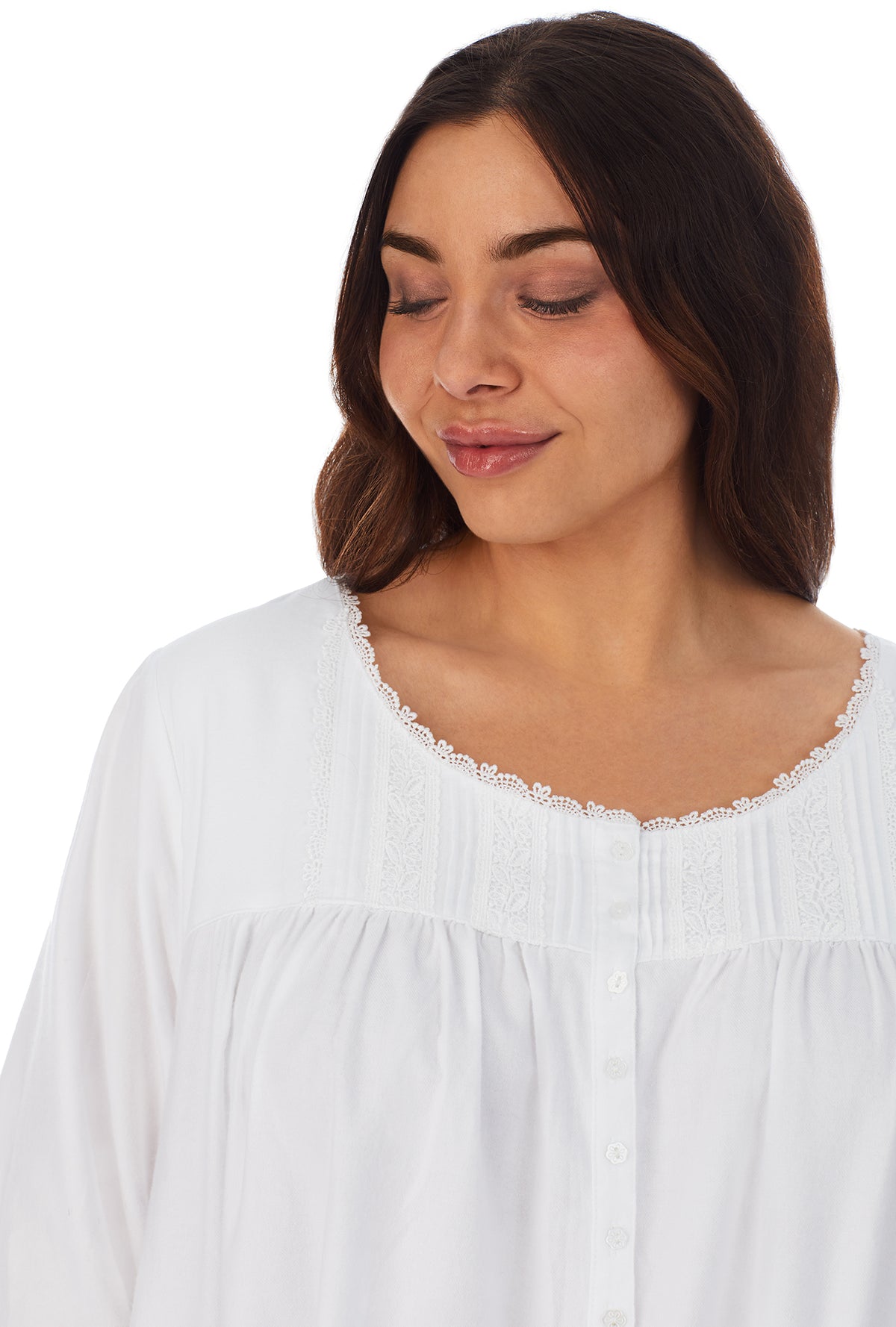 A lady wearing a white long sleeve rayon lightweight flannel waltz nightgown plus.