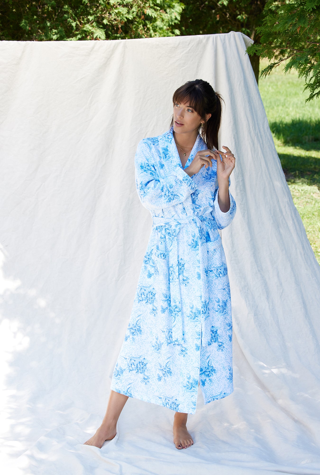 A lady wearing a pastoral floral long sleeve wrap robe.