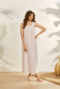 A lady wearing pink sleeveless eileen dobby stripe rose gown.