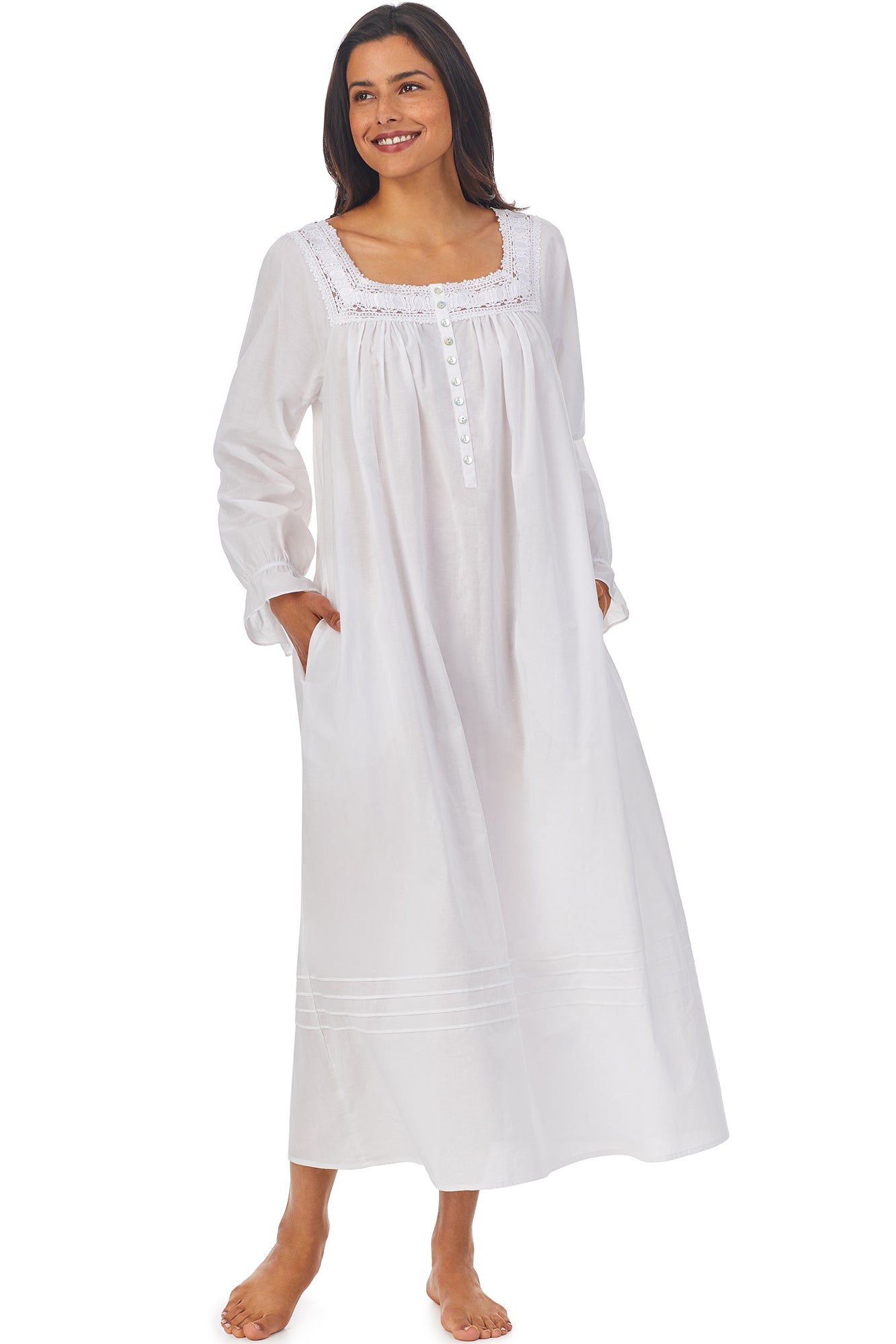 A lady wearing white long sleeve nightgown