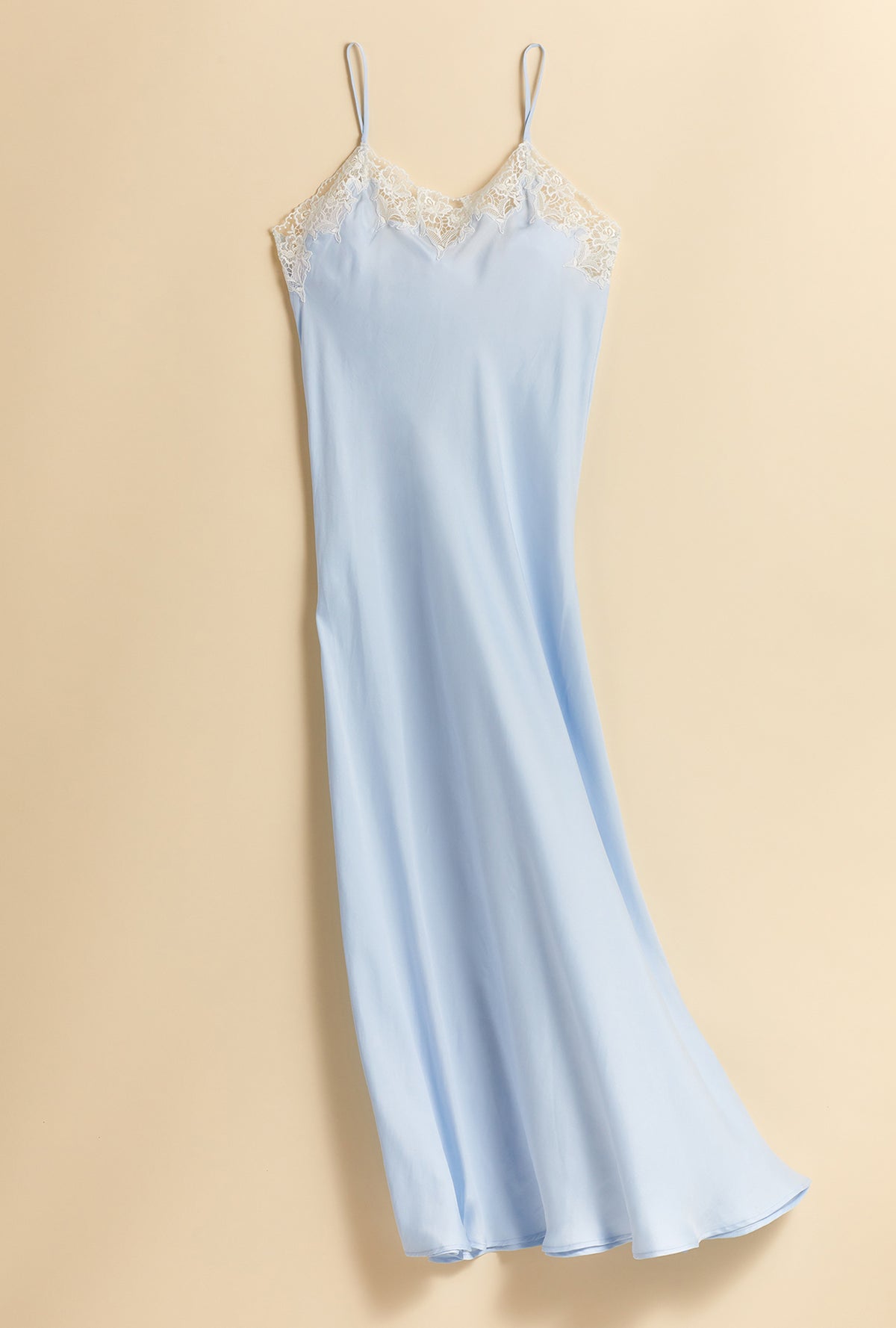 A lady wearing a blue sleeveless satin gown.A lady wearing blue sleeveless santorini satin gown.