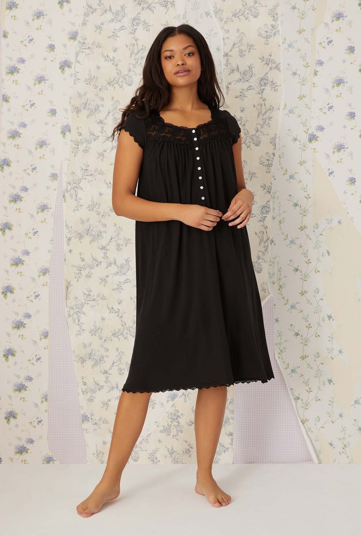 A lady wearing black villa blanca waltz knit nightgown.