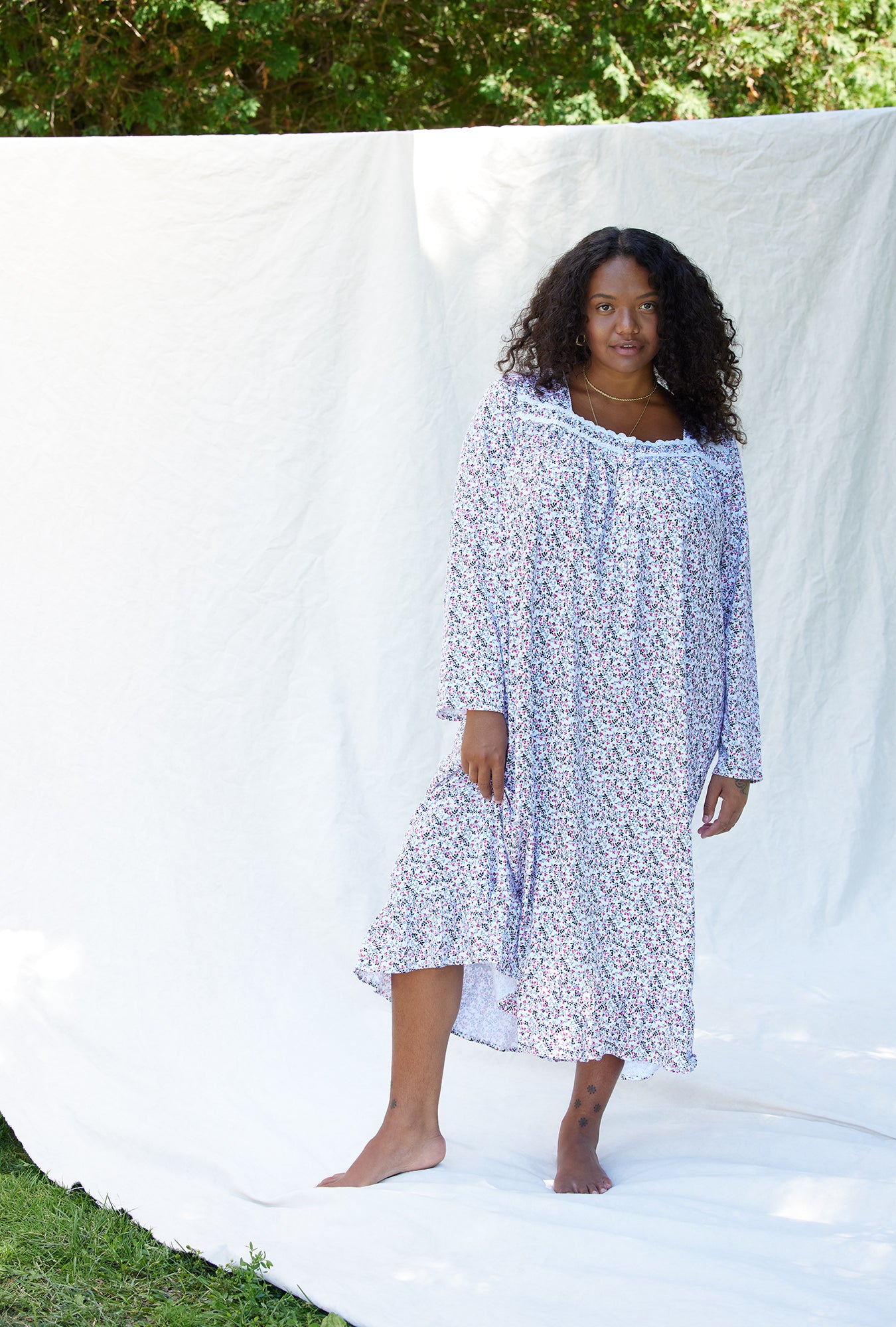 A lady wearing a berry dream long sleeve cotton knit long nightgown.
