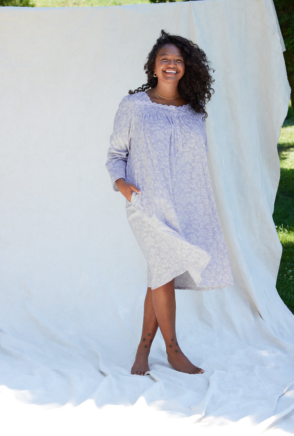 A lady wearing a dream fleece long sleeve waltz nightgown plus size.