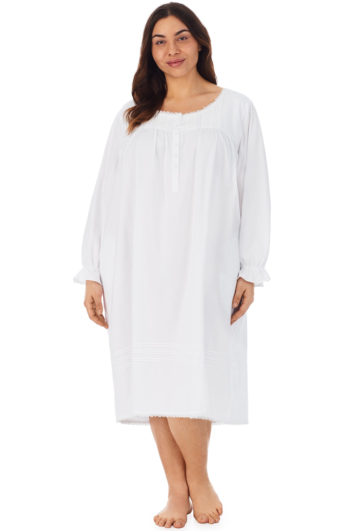 A lady wearing a white long sleeve rayon lightweight flannel waltz nightgown plus.